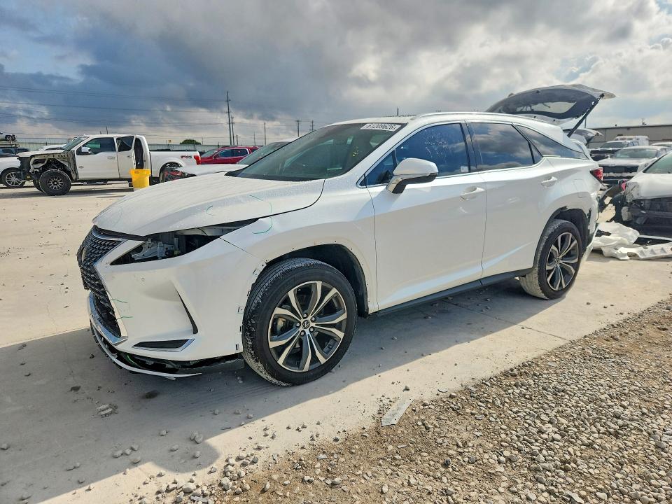 LEXUS RX 2021 with VIN JTJHZKEA0M2021184 - Photo from auction