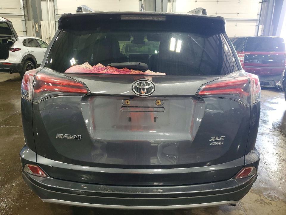 Photo 6 from auction – 2018 TOYOTA RAV4 with VIN JTMRFREV5JD254375