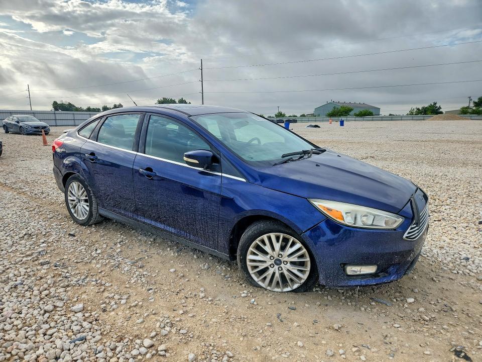 Foto 4 de la subasta – 2016 FORD FOCUS con VIN 1FADP3J21GL296868