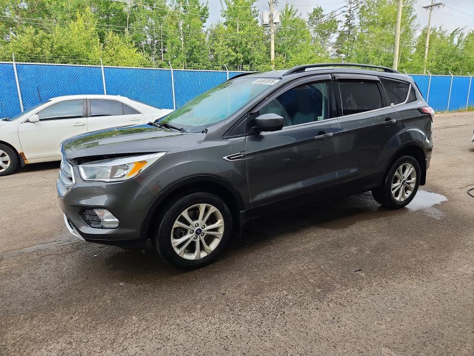 FORD ESCAPE 2018 with VIN 1FMCU9GD6JUC65557 - Photo from auction