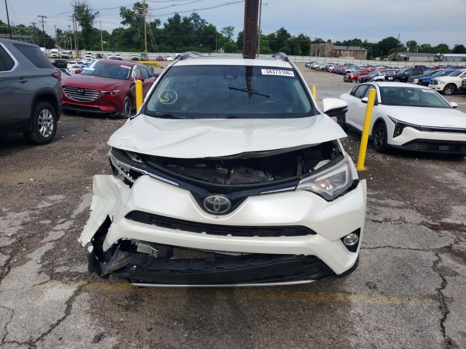 Photo 5 from auction – 2018 TOYOTA RAV4 with VIN JTMDFREV2JJ231406