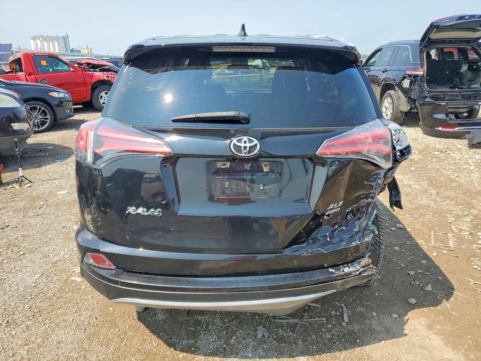 Photo 6 from auction – 2018 TOYOTA RAV4 with VIN 2T3RFREV7JW799416