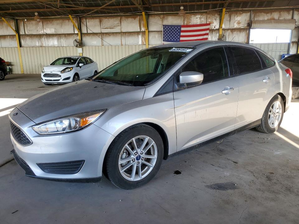 FORD FOCUS 2018 with VIN 1FADP3FEXJL240180 - Photo from auction