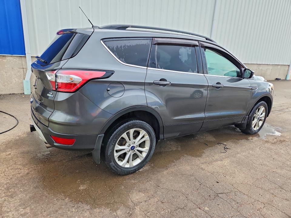 Photo 3 from auction – 2018 FORD ESCAPE with VIN 1FMCU9GD6JUC65557