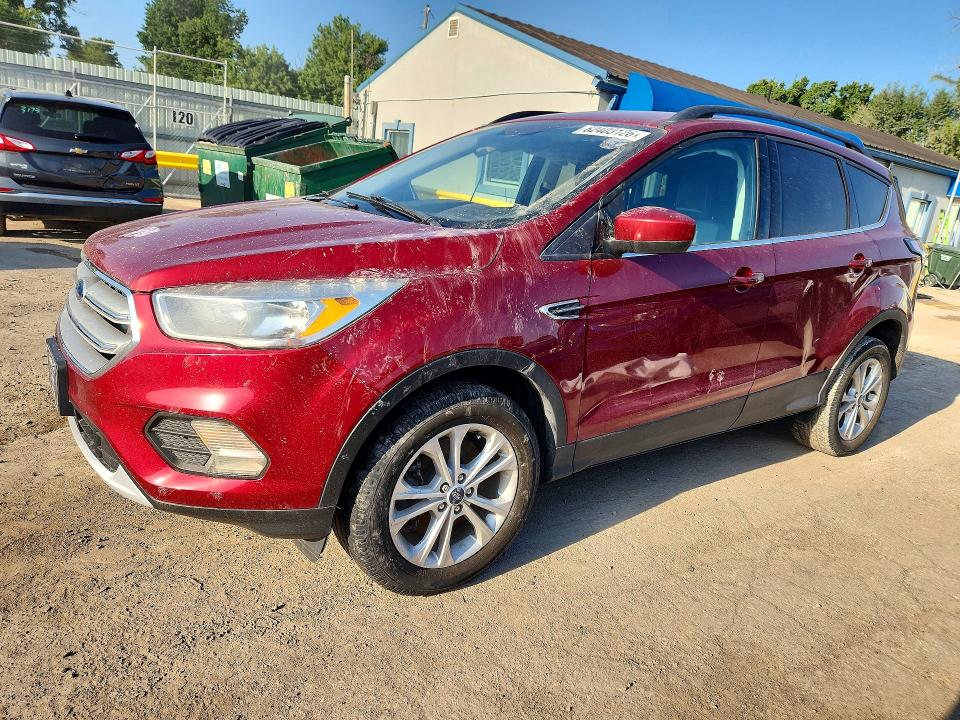 FORD ESCAPE 2018 with VIN 1FMCU9GD0JUD31455 - Photo from auction