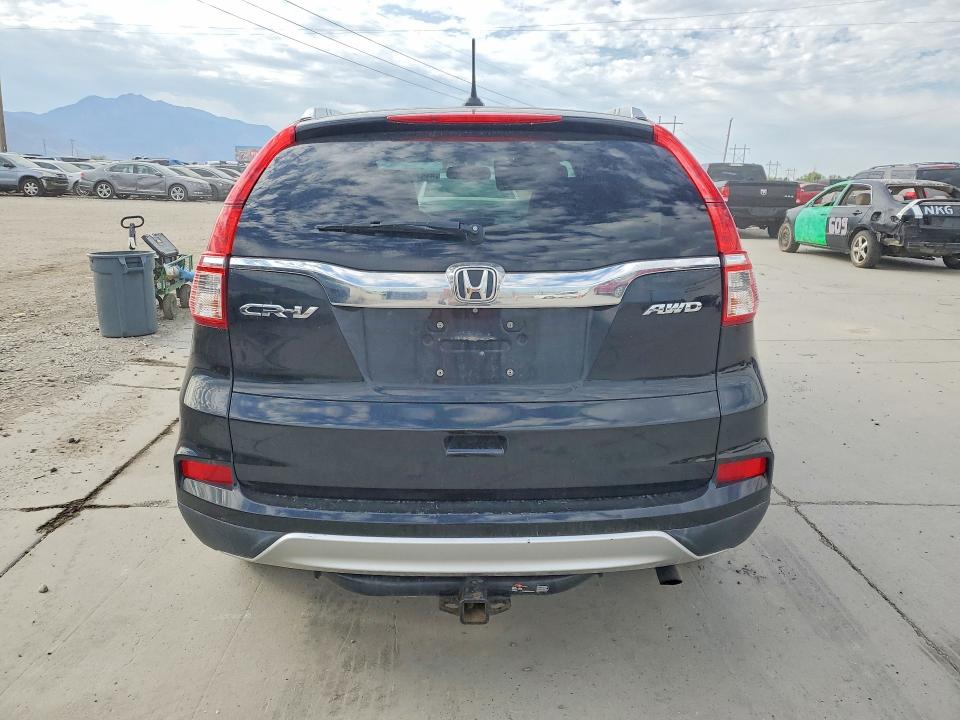 Photo 6 from auction – 2015 HONDA CR-V with VIN 2HKRM4H71FH659687