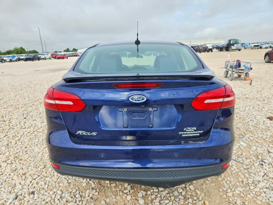 Foto 6 de la subasta – 2016 FORD FOCUS con VIN 1FADP3J21GL296868