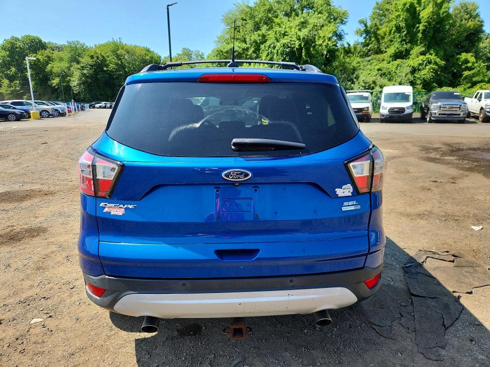 Photo 6 from auction – 2018 FORD ESCAPE with VIN 1FMCU9H91JUB63402