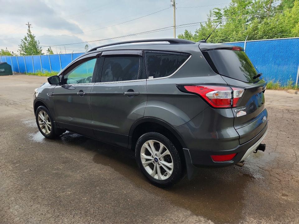 Photo 2 from auction – 2018 FORD ESCAPE with VIN 1FMCU9GD6JUC65557