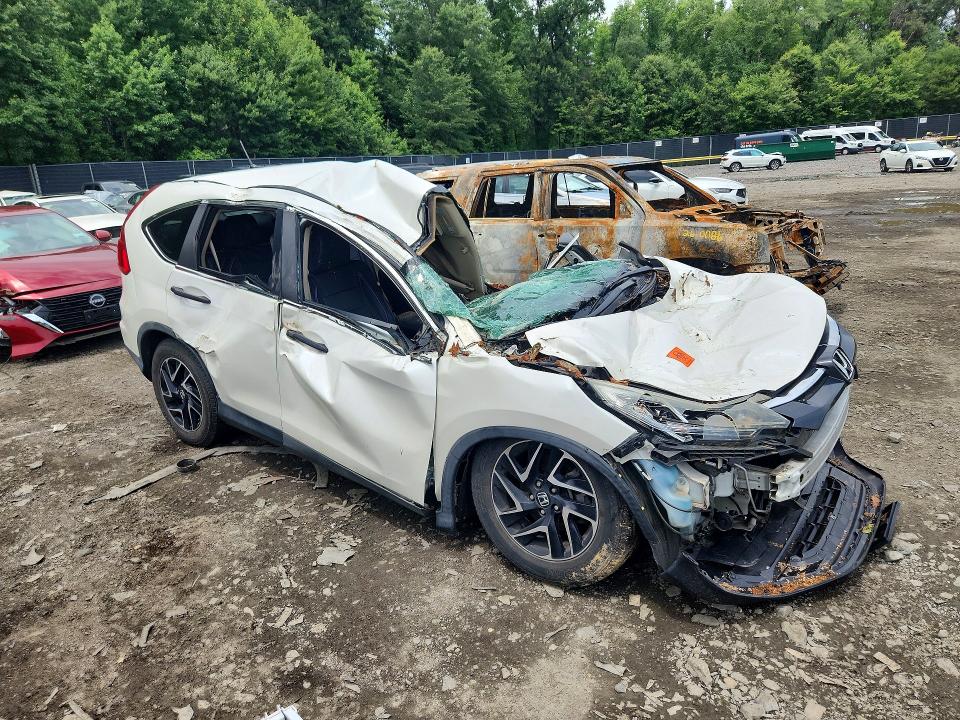 Photo 4 from auction – 2016 HONDA CR-V with VIN 5J6RM4H47GL049256