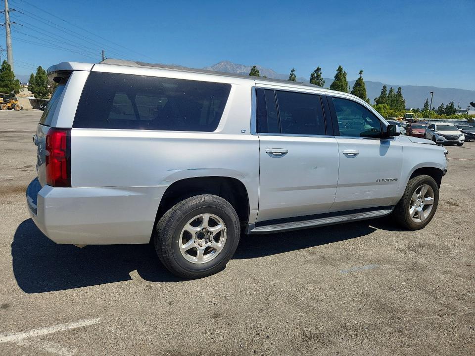 Photo 3 from auction – 2019 CHEVROLET SUBURBAN with VIN 1GNSCHKC8KR302003