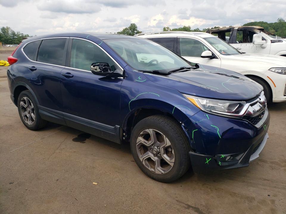 Photo 4 from auction – 2018 HONDA CR-V with VIN 7FARW2H54JE063949