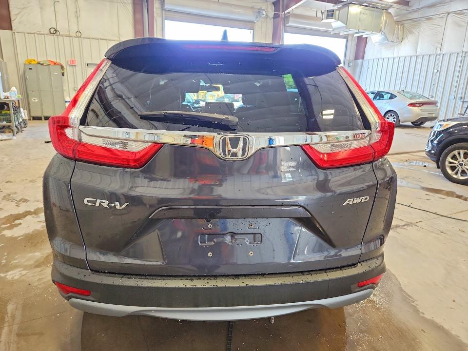 Photo 6 from auction – 2017 HONDA CR-V with VIN 5J6RW2H86HL024562