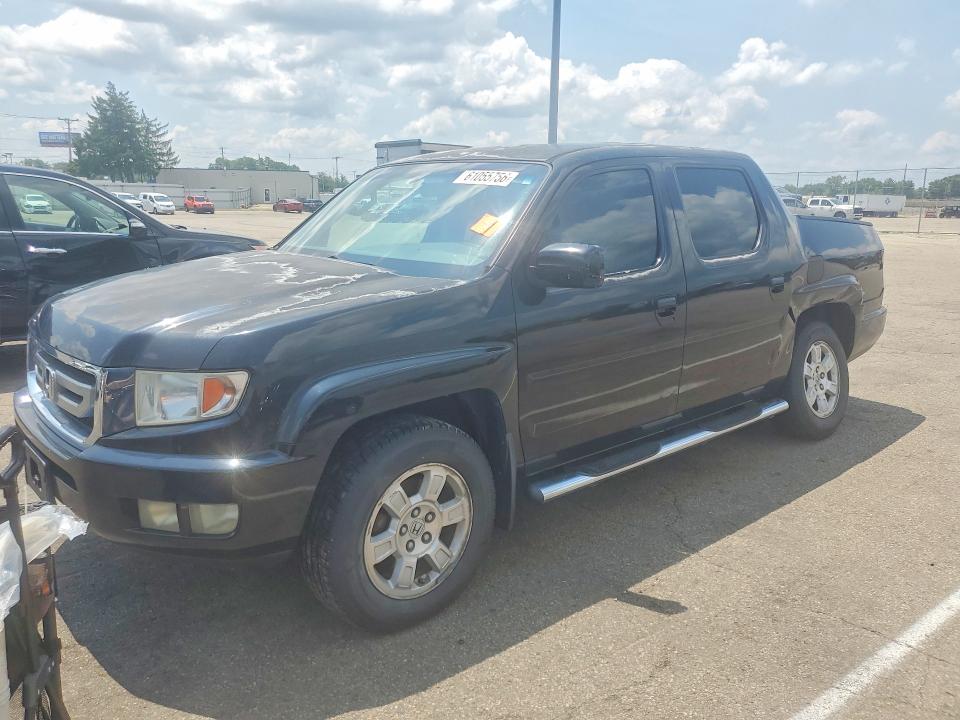 HONDA RIDGELINE 2011 with VIN 5FPYK1F40BB002694 - Photo from auction