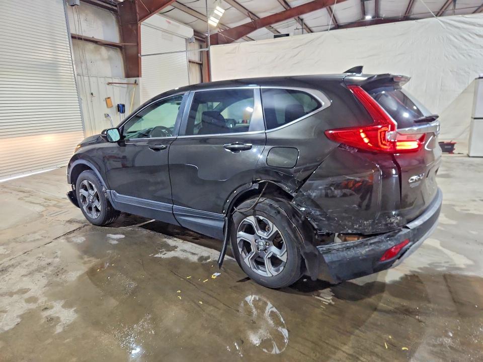 Photo 2 from auction – 2018 HONDA CR-V with VIN 2HKRW2H50JH696638