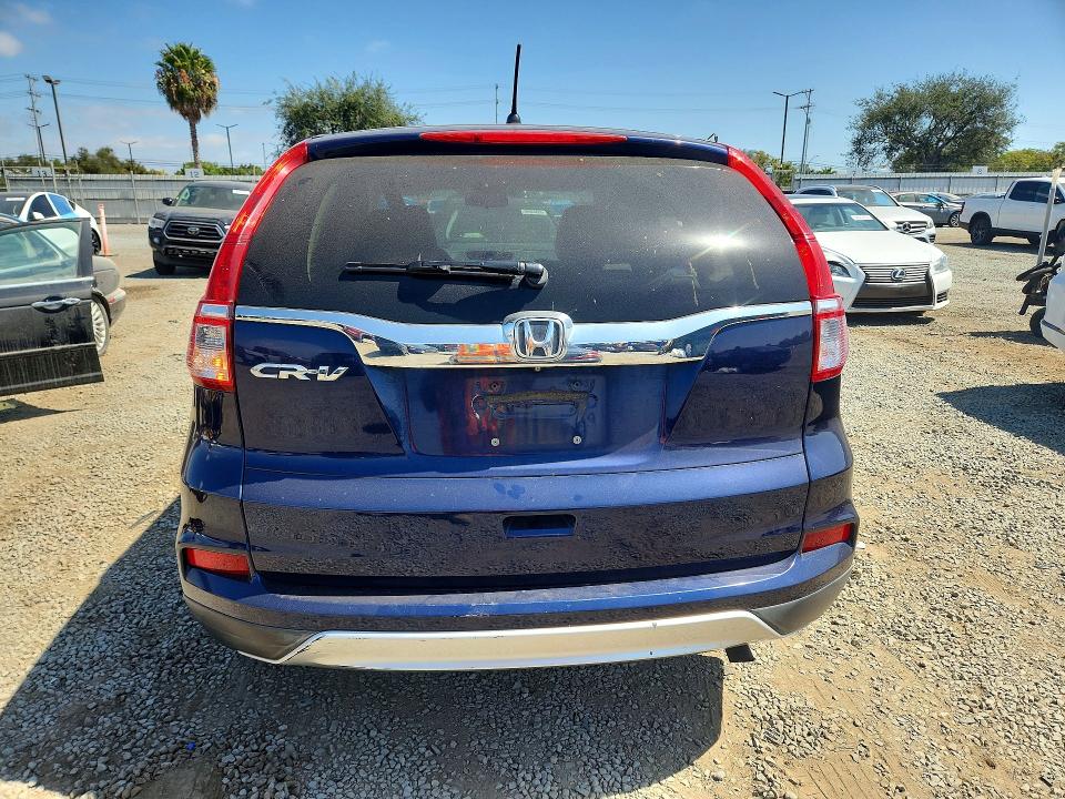 Photo 6 from auction – 2015 HONDA CR-V with VIN 3CZRM3H52FG710576