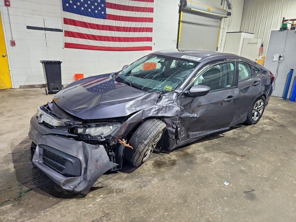 HONDA CIVIC 2018 with VIN 19XFC2F51JE029838 - Photo from auction