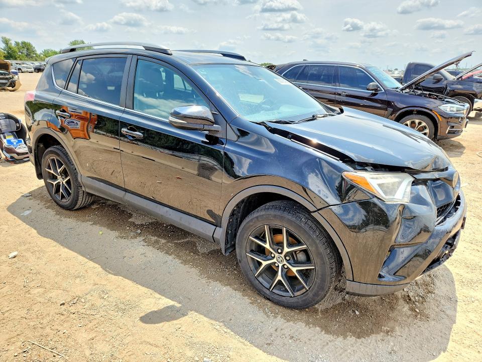 Photo 4 from auction – 2018 TOYOTA RAV4 with VIN 2T3JFREVXJW785698