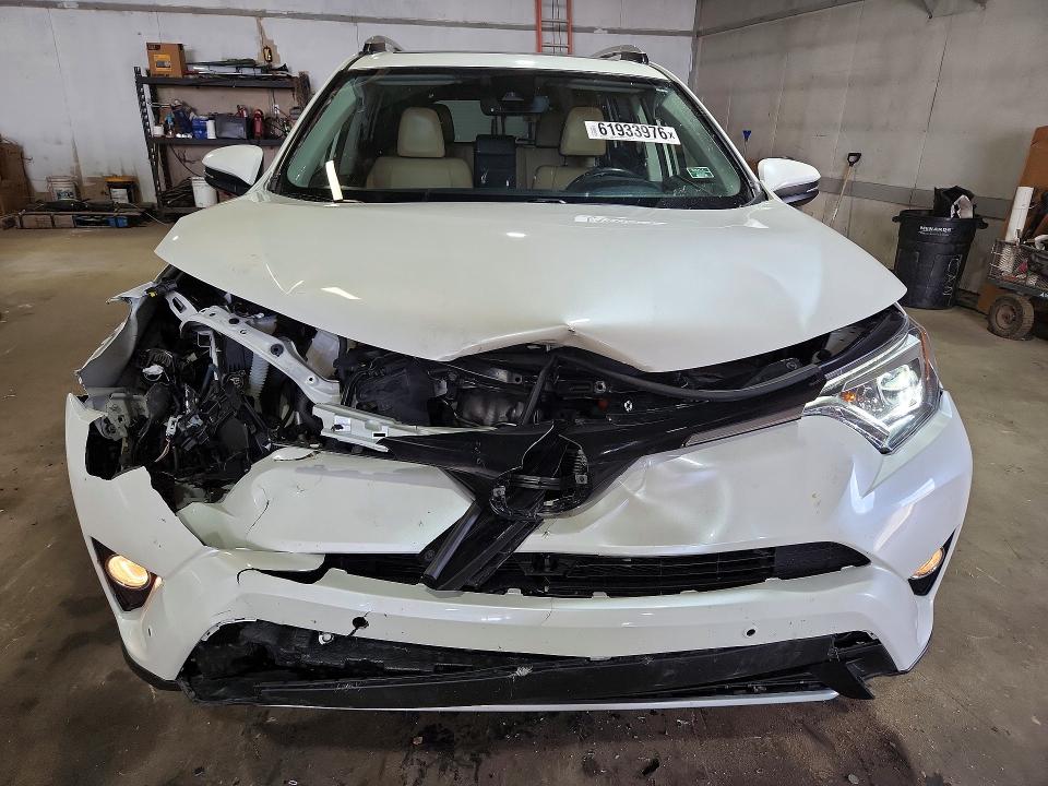 Photo 5 from auction – 2016 TOYOTA RAV4 HV with VIN JTMDJREV0GD032103