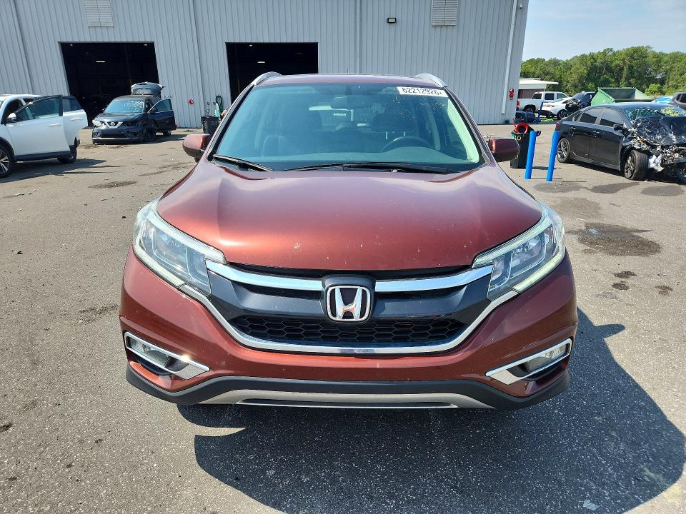 Photo 5 from auction – 2015 HONDA CR-V with VIN 2HKRM3H73FH546401