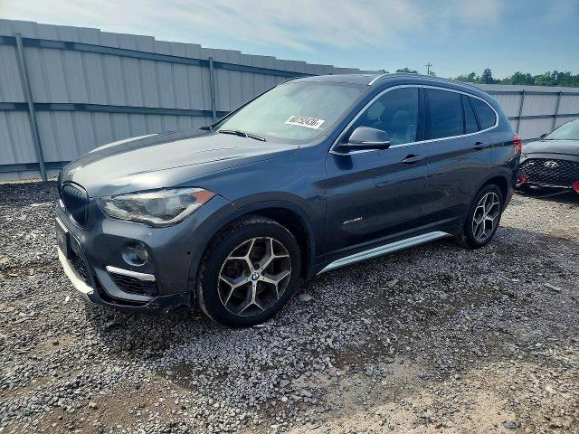 BMW X1 2017 with VIN WBXHT3C33H5F72590 - Photo from auction