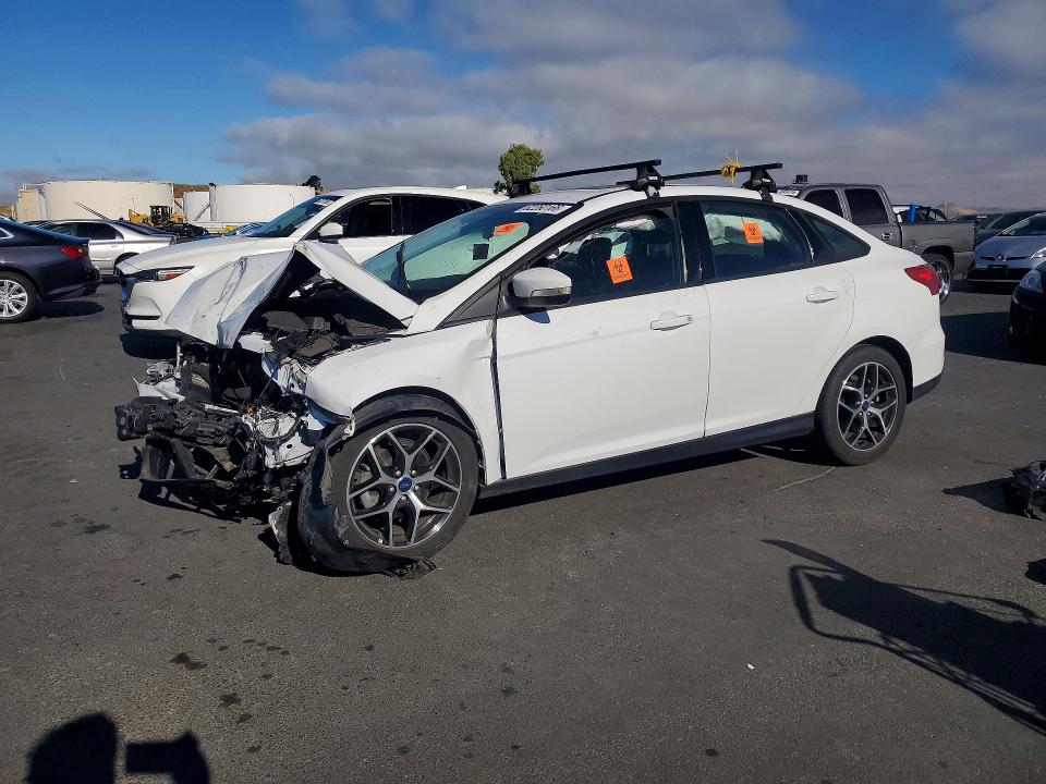FORD FOCUS 2017 with VIN 1FADP3H23HL333443 - Photo from auction