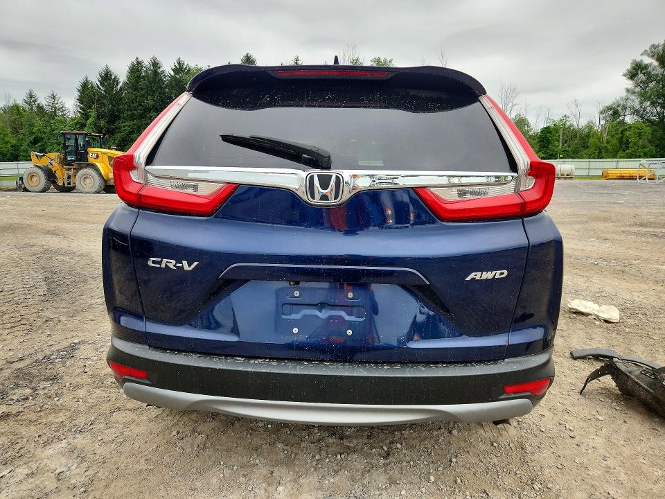 Photo 6 from auction – 2018 HONDA CR-V with VIN 7FARW2H85JE080107