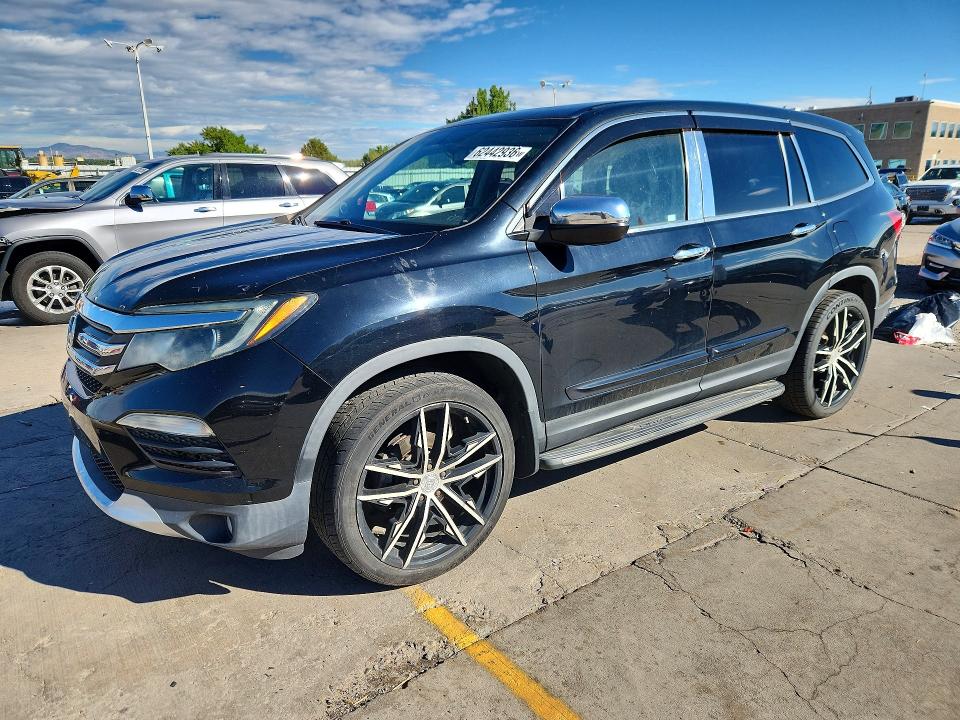 HONDA PILOT 2016 with VIN 5FNYF6H59GB079863 - Photo from auction