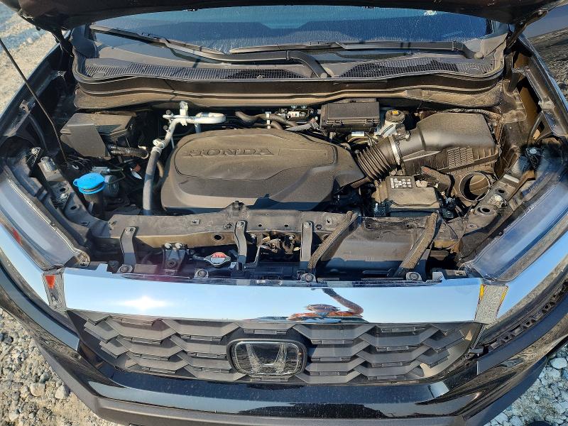 Photo 12 from auction – 2023 HONDA PASSPORT with VIN 5FNYF8H50PB013813