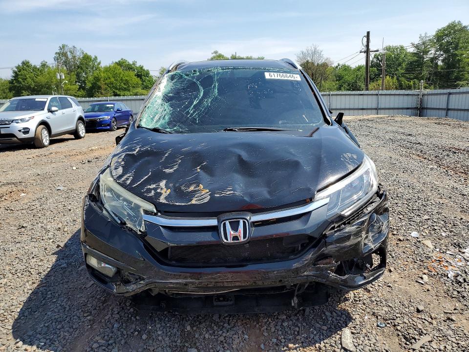 Photo 5 from auction – 2015 HONDA CR-V with VIN 2HKRM4H71FH633669
