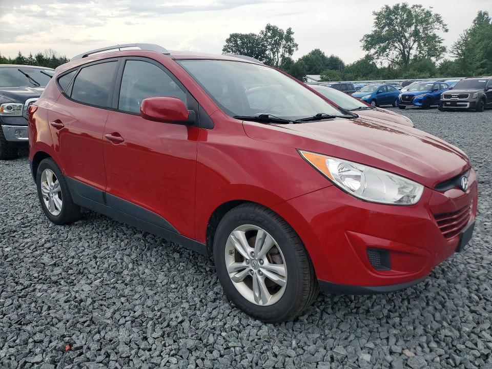 Photo 4 from auction – 2010 HYUNDAI TUCSON with VIN KM8JUCAC6AU021685