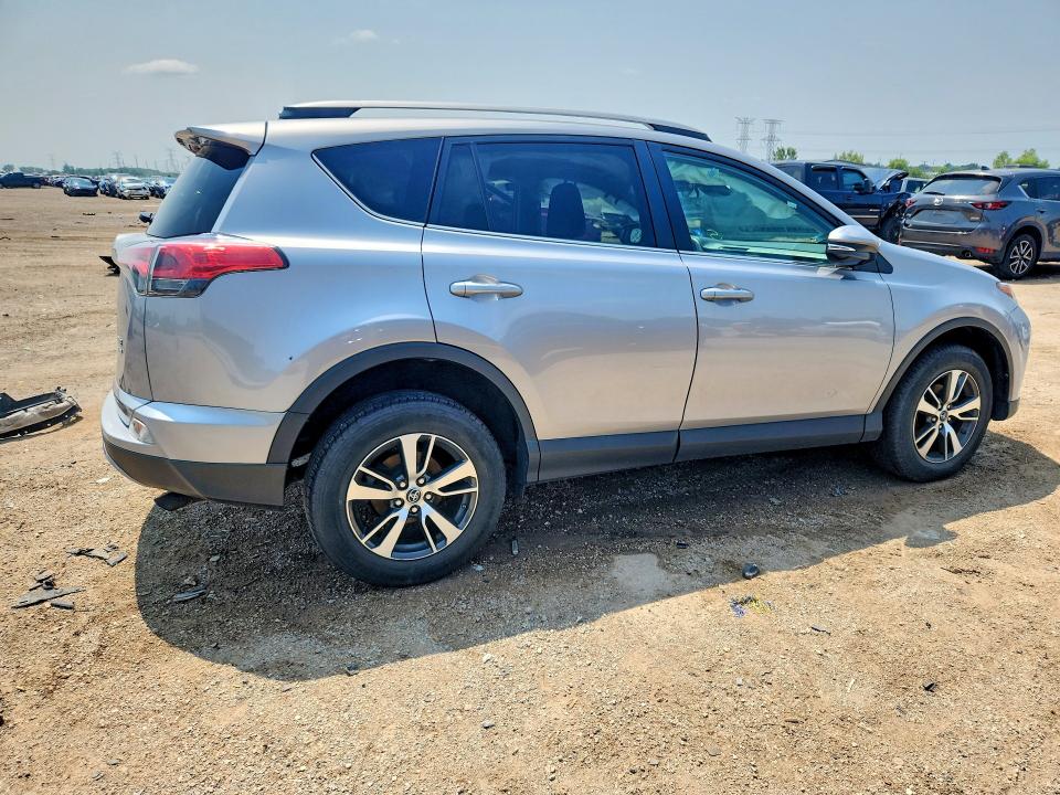 Photo 3 from auction – 2018 TOYOTA RAV4 with VIN 2T3RFREV2JW704955