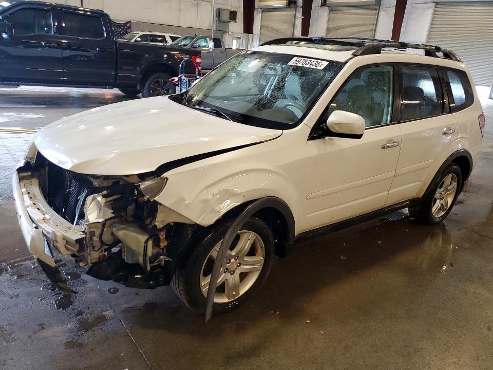 SUBARU FORESTER 2010 with VIN JF2SH6CC9AH784399 - Photo from auction
