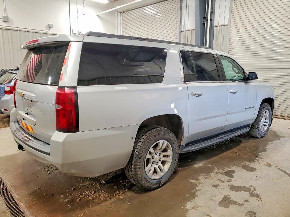 Photo 3 from auction – 2020 CHEVROLET SUBURBAN with VIN 1GNSKHKC2LR284425