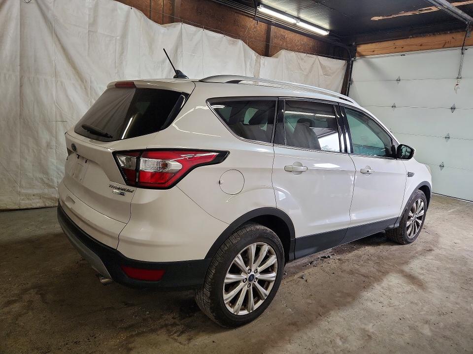 Photo 3 from auction – 2018 FORD ESCAPE with VIN 1FMCU9J92JUB21279