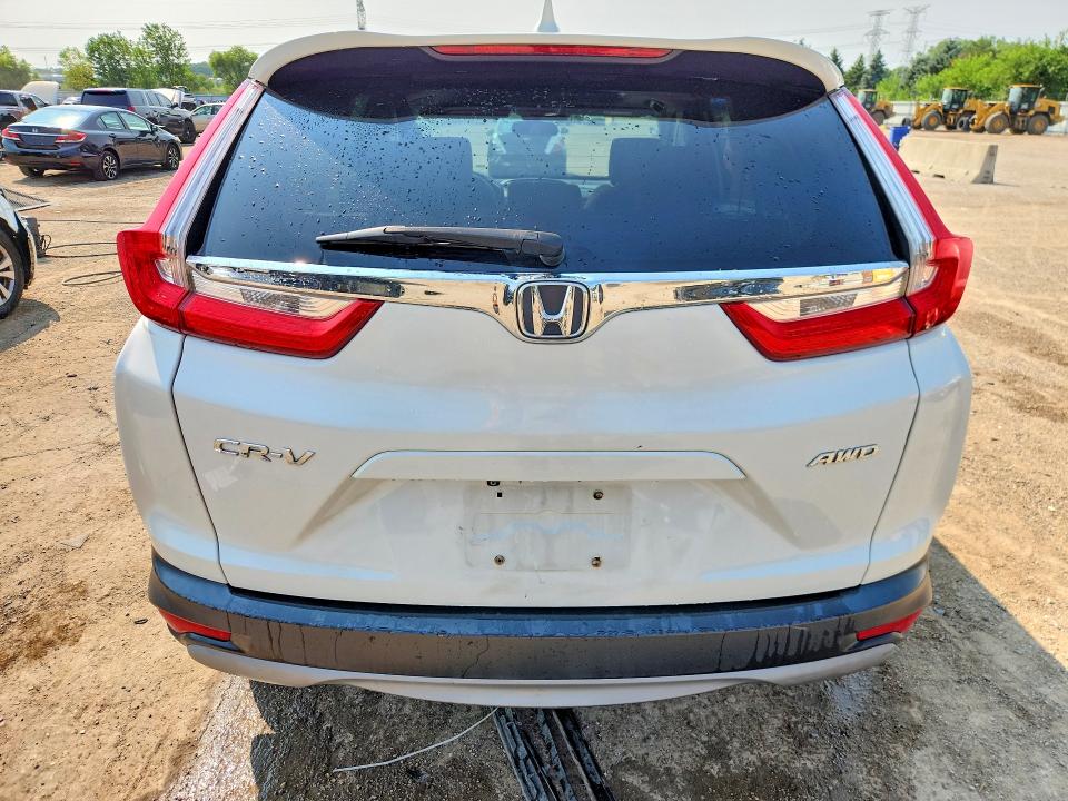 Photo 6 from auction – 2018 HONDA CR-V with VIN 5J6RW2H55JL011930
