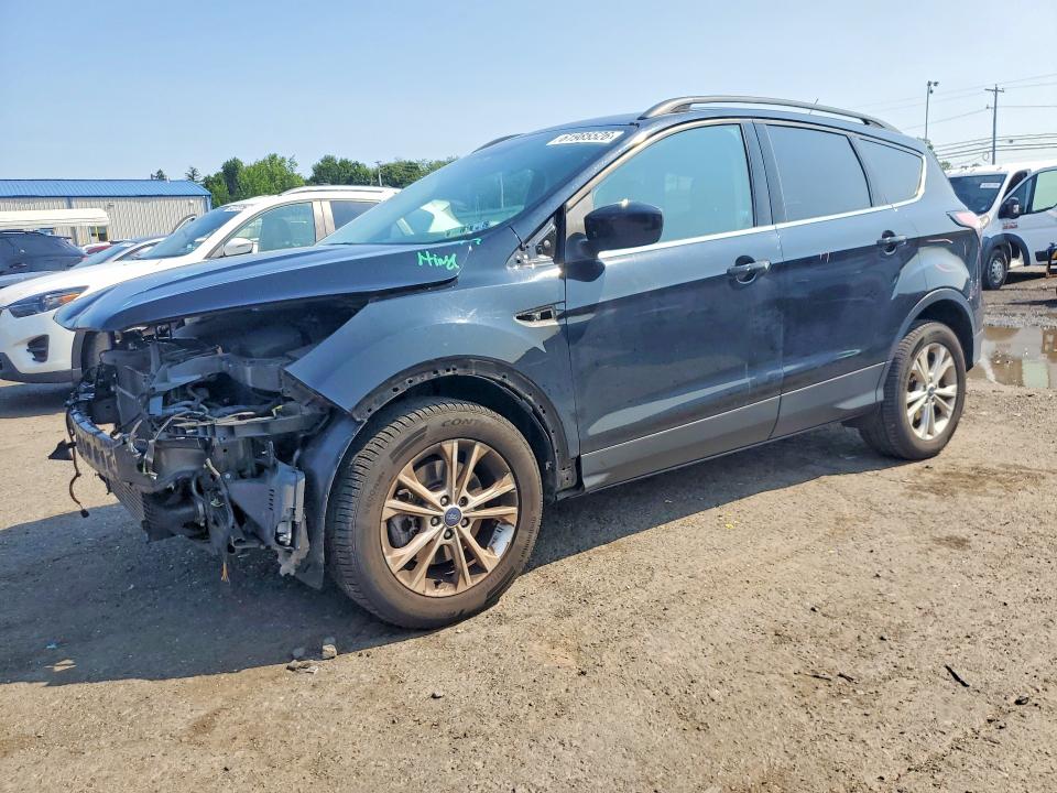 FORD ESCAPE 2017 with VIN 1FMCU9G94HUE28308 - Photo from auction