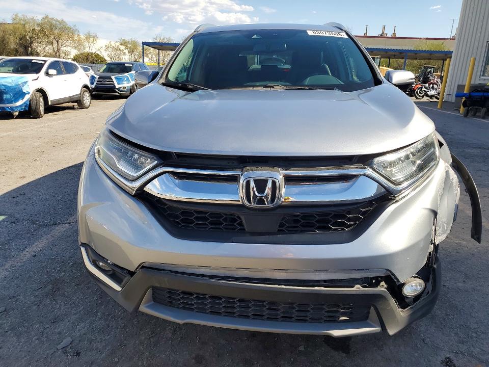 Photo 5 from auction – 2018 HONDA CR-V with VIN 7FARW2H97JE061762