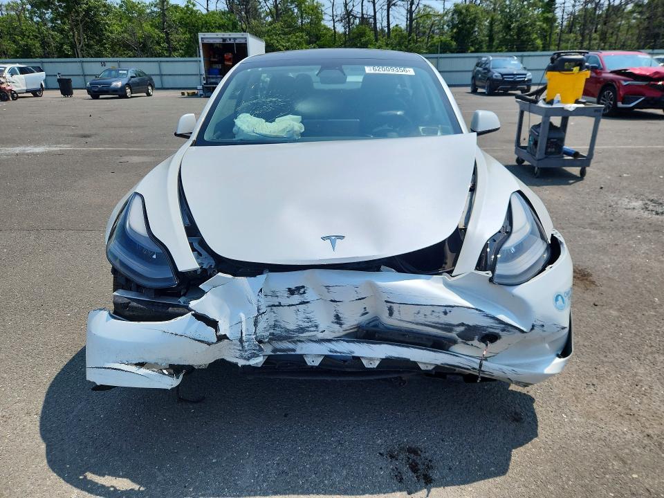 Photo 5 from auction – 2021 TESLA MODEL 3 with VIN 5YJ3E1EB4MF051037