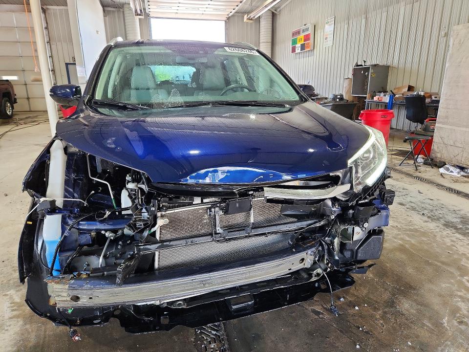 Photo 5 from auction – 2016 HONDA CR-V with VIN 5J6RM4H96GL016843