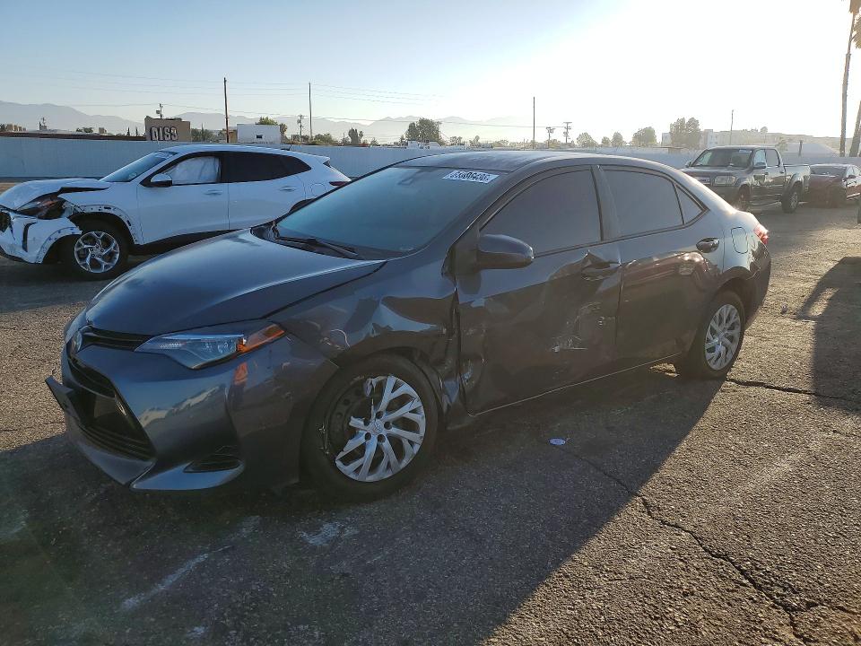 TOYOTA COROLLA 2018 with VIN 5YFBURHE5JP855429 - Photo from auction