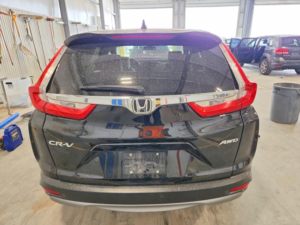 Photo 6 from auction – 2018 HONDA CR-V with VIN 7FARW2H55JE005073