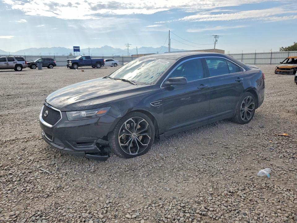 FORD TAURUS 2015 with VIN 1FAHP2KT3FG199732 - Photo from auction