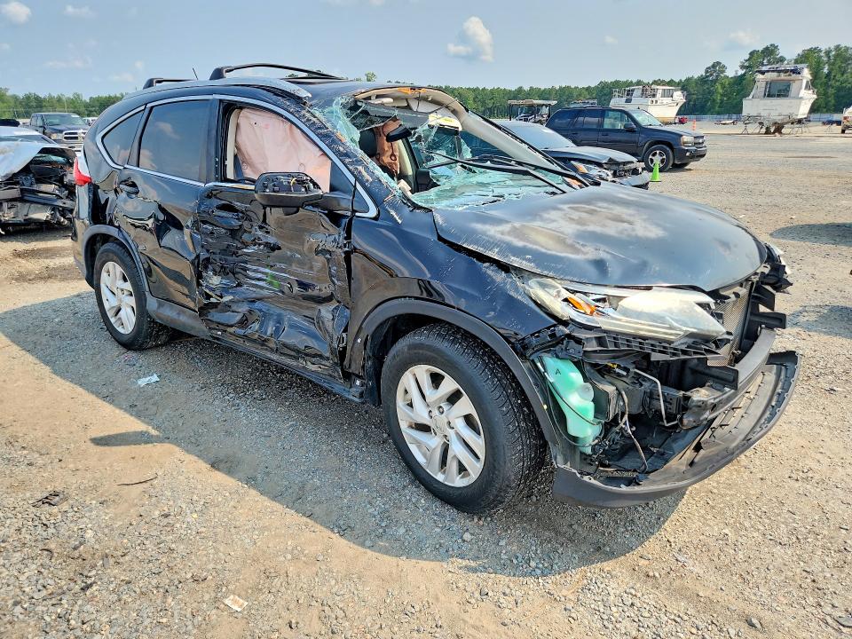 Photo 4 from auction – 2016 HONDA CR-V with VIN 2HKRM3H73GH558582
