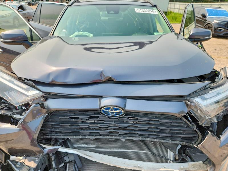 Photo 12 from auction – 2023 TOYOTA RAV4 HYBRID with VIN JTMRWRFV5PD188093