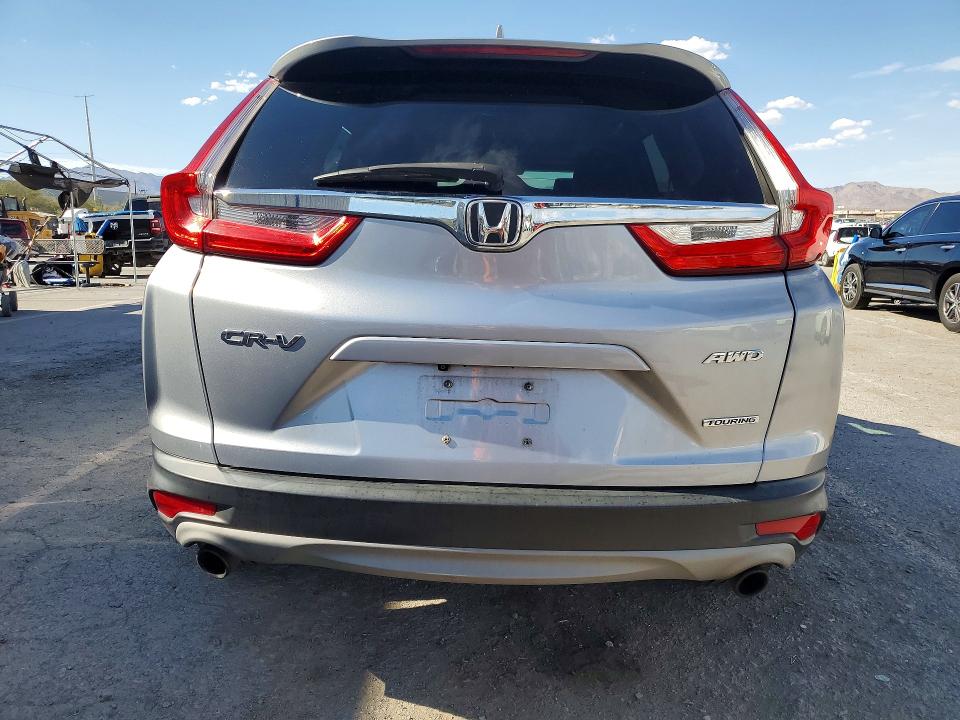 Photo 6 from auction – 2018 HONDA CR-V with VIN 7FARW2H97JE061762