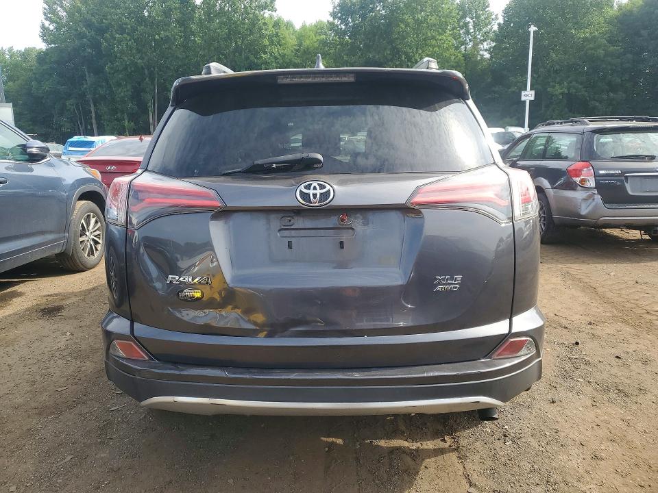 Photo 6 from auction – 2018 TOYOTA RAV4 with VIN JTMRFREV7JJ735018