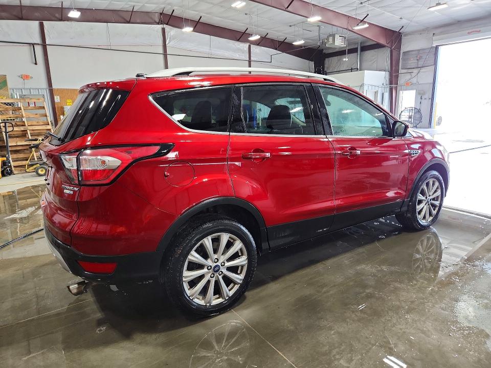 Photo 3 from auction – 2017 FORD ESCAPE with VIN 1FMCU9J96HUD56536