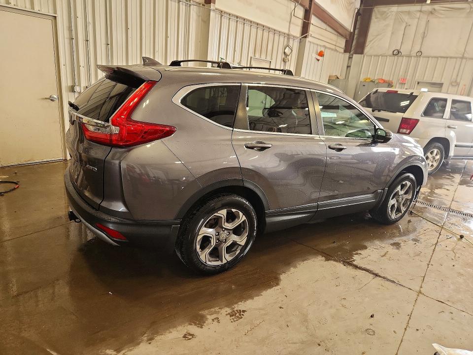 Photo 3 from auction – 2019 HONDA CR-V with VIN 7FARW2H5XKE034070