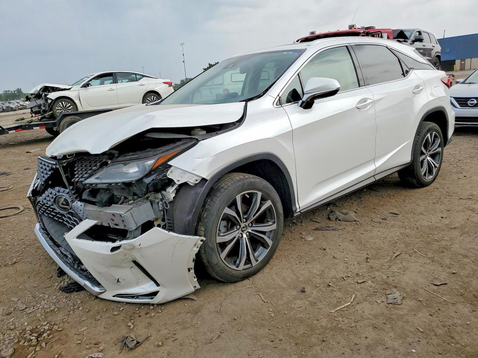 LEXUS RX 2021 with VIN 2T2HZMDA4MC261674 - Photo from auction